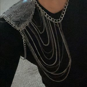 Shoulder chain necklace with snakeskin shoulder.